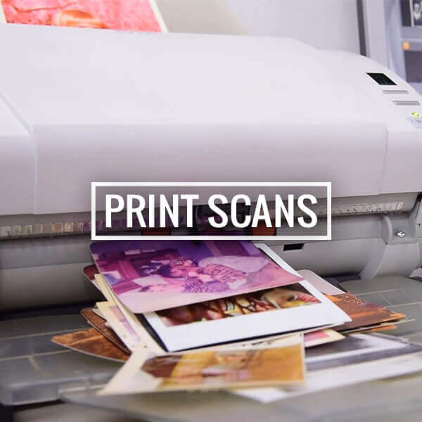 Flatbed scanner digitizing printed photographs for archival preservation