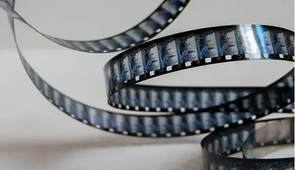 Vintage home movie film camera with 8mm or 16mm reels for film transfer and digitizing