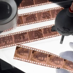 Film negatives being checked on a light table before being converted to digital images