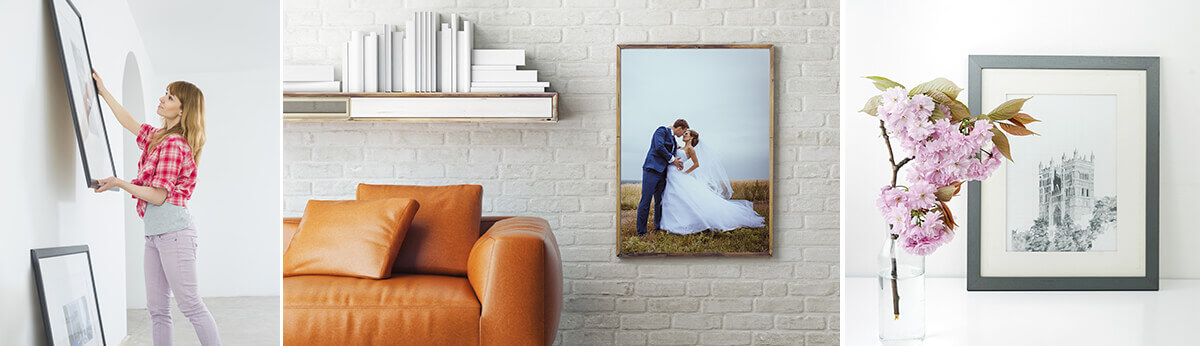 Custom framed photograph displayed in a styled living room with sofa and decorative accents