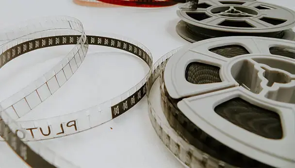 8mm or 16mm motion picture film reels and loose film strip prepared for digitizing