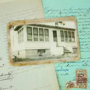 Vintage photograph placed on handwritten letters and historical documents for preservation and digitization