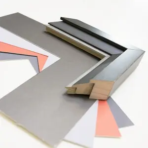 Custom picture framing materials including mat board, frame samples, and mounting supplies