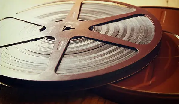 8mm or 16mm motion picture film reels and loose film strip prepared for digitizing