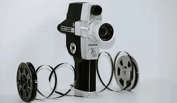 Vintage home movie film camera with 8mm or 16mm reels for film transfer and digitizing