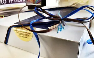 Custom branded packaging including boxes, ribbon, tissue and retail packaging materials