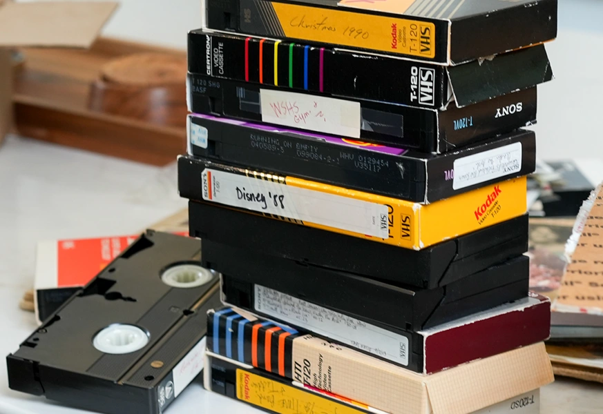 Digitized home video footage playing on a tablet after professional VHS transfer at The Camera Shop in St. Cloud, MN