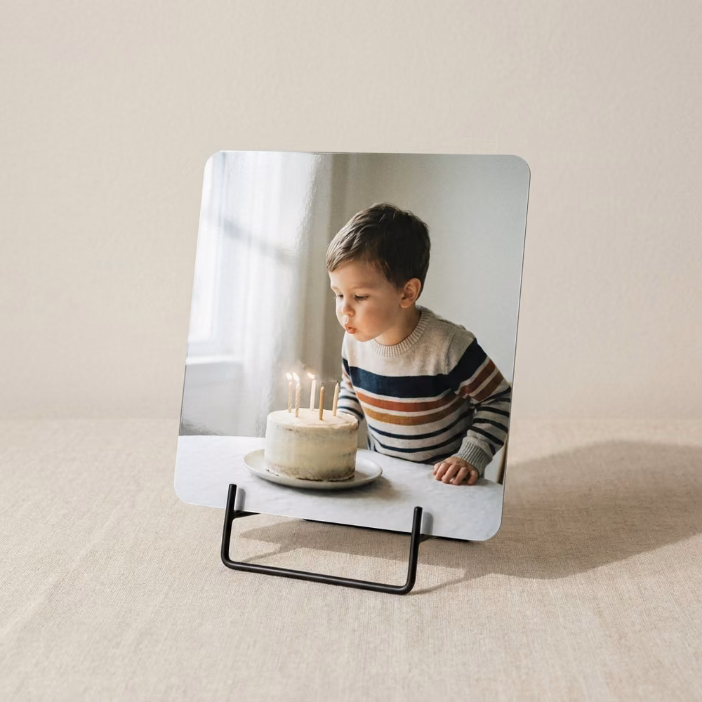 Small metal photo print on a desk easel