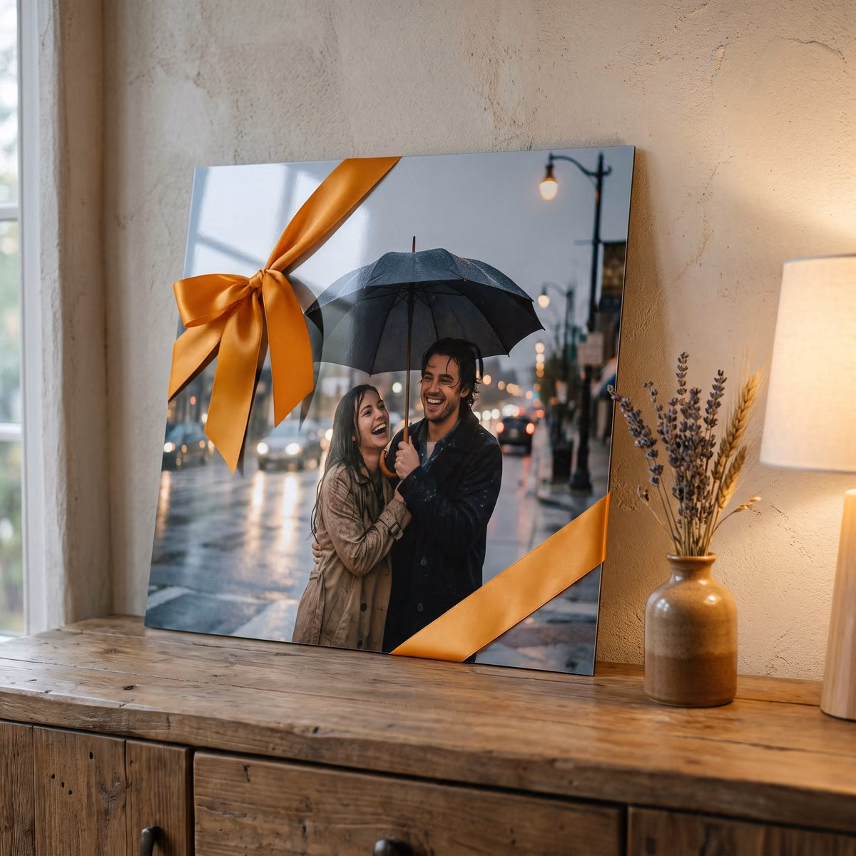 Metal print of a couple in the rain tied with an orange ribbon