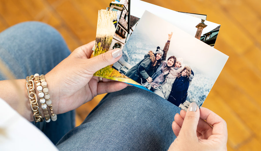 Lady holding photo prints