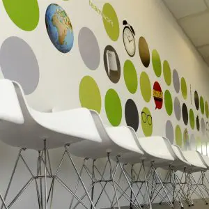 Modern office waiting area with custom wall graphic made of colorful circular decals