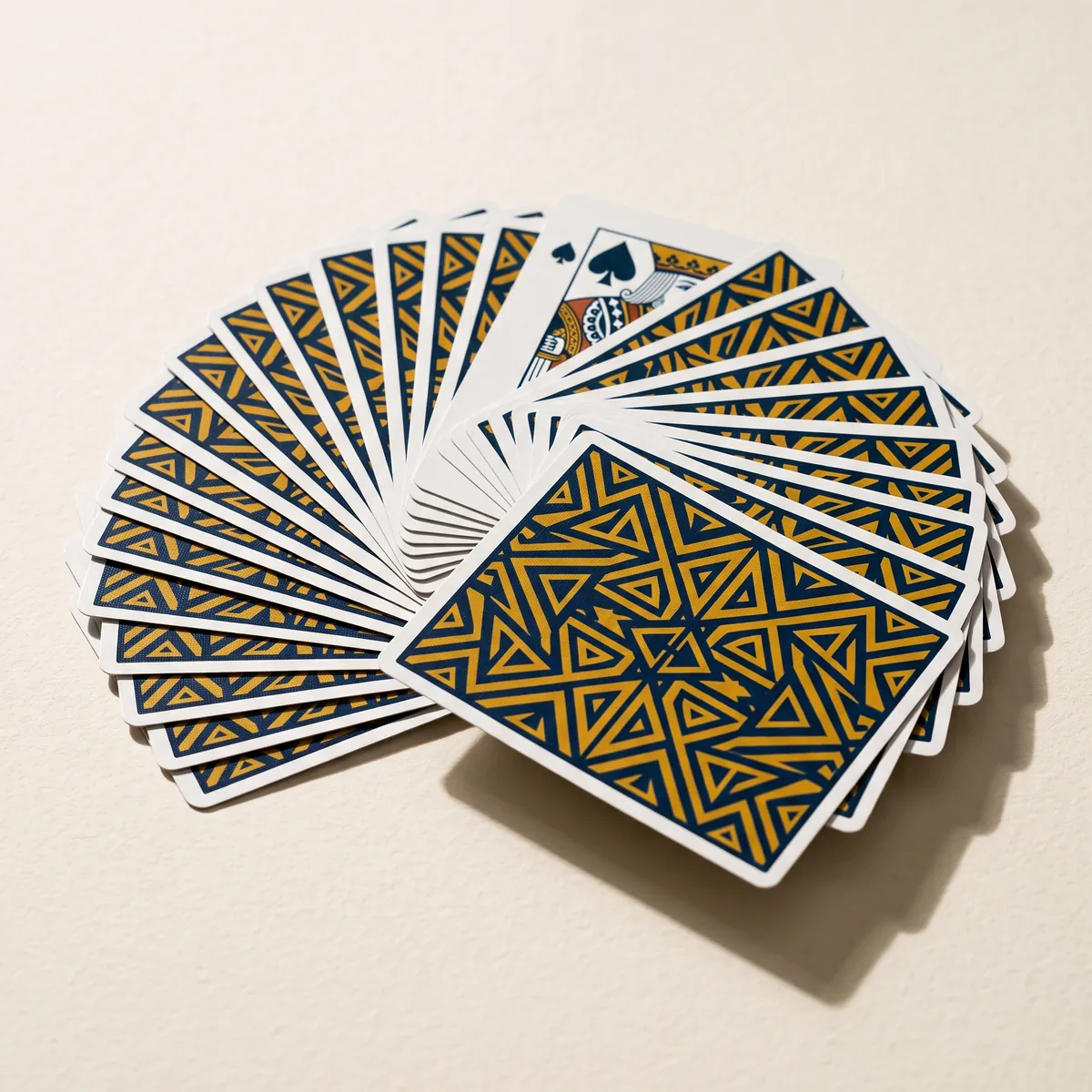 Deck of custom playing cards fanned in an arc.