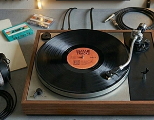 Old audio cassette tapes and vinyl records ready for digital transfer at Linhoff Photo, St. Louis Park, MN