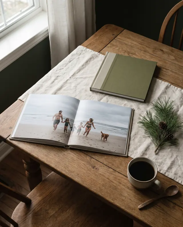 Open photo book on an oak table