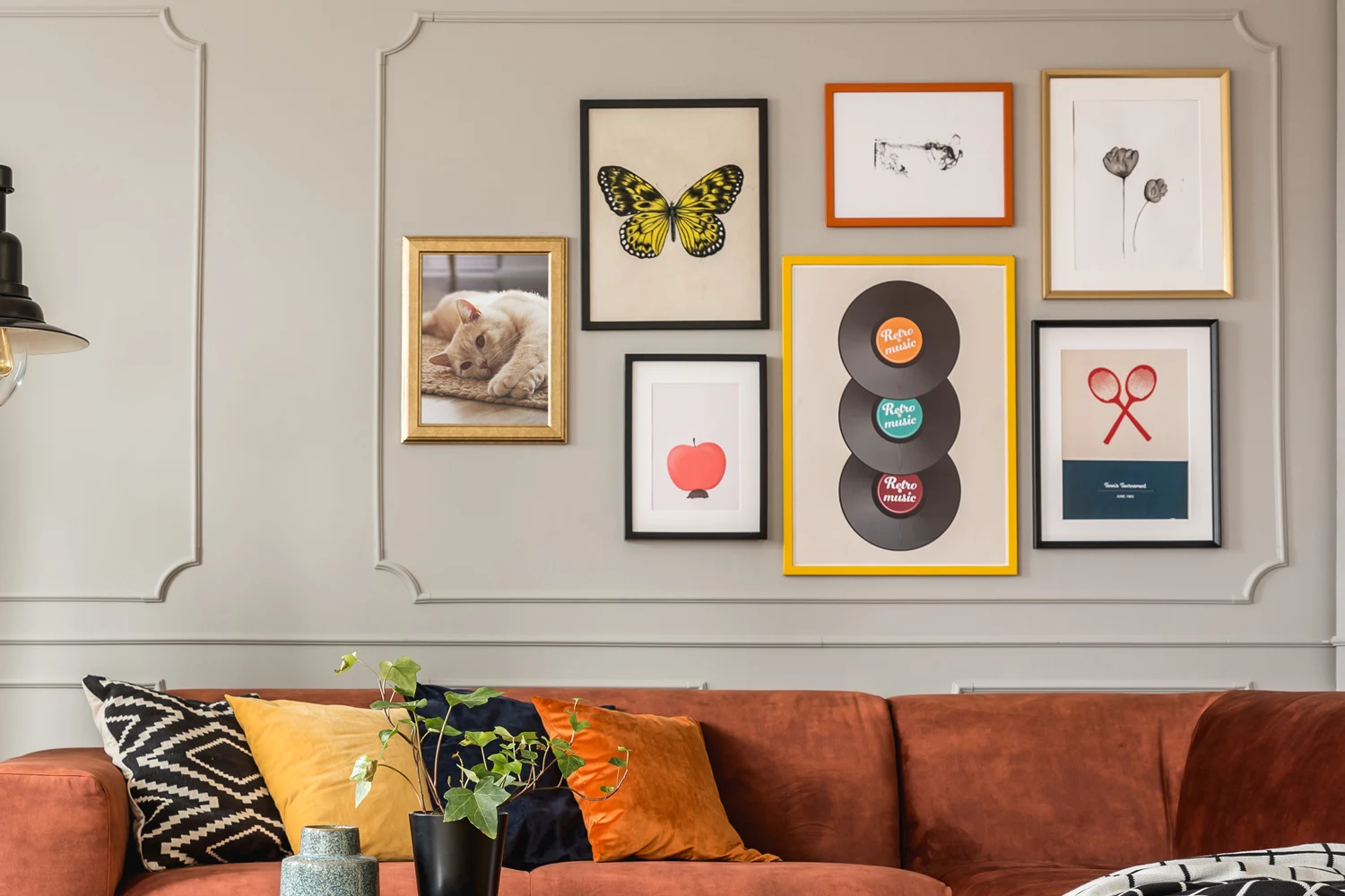 Stylish living room with a gallery wall featuring custom-framed artwork and photographs, creating a personalized and elegant decor