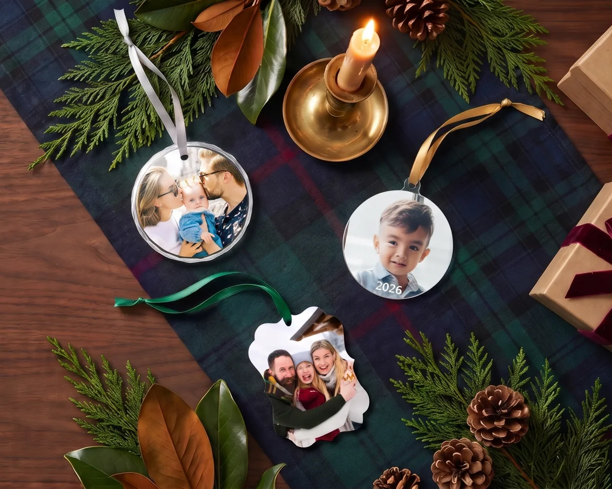 Photo ornaments on a tartan runner with greenery