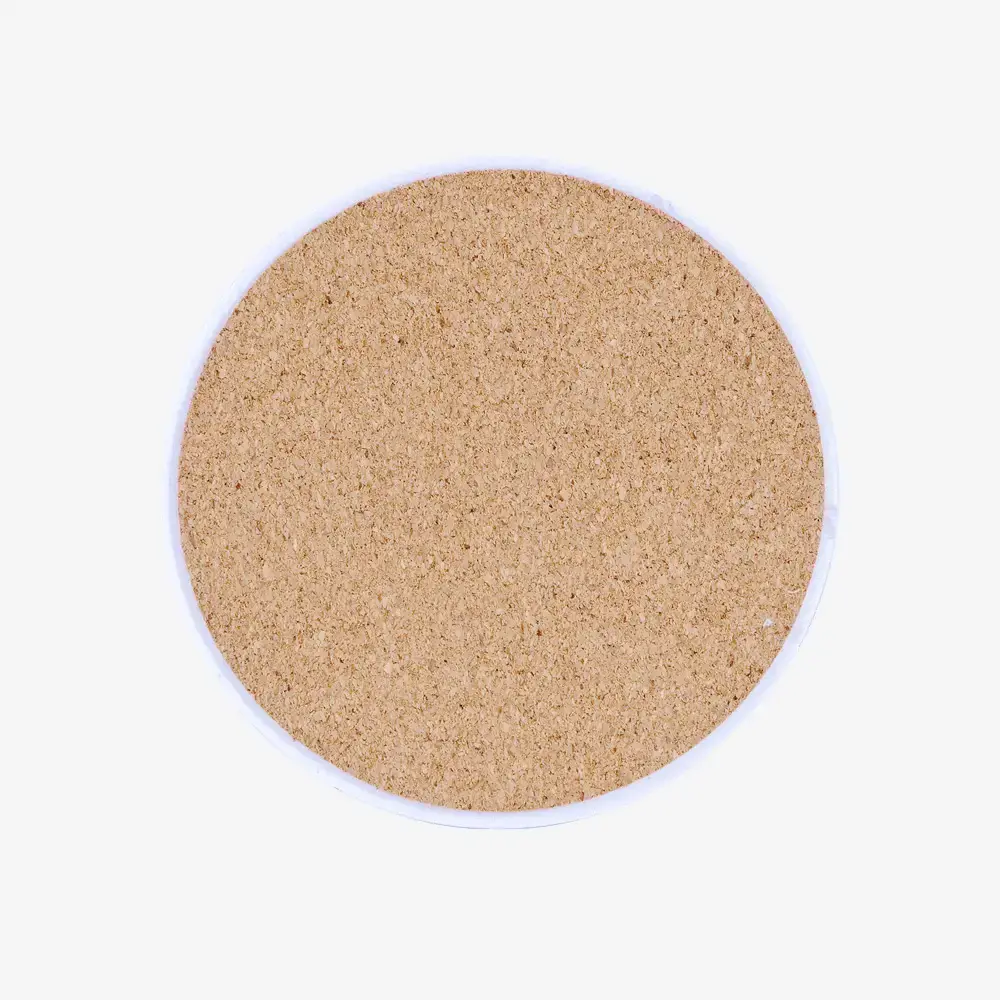Cork on back of round marble photo coaster