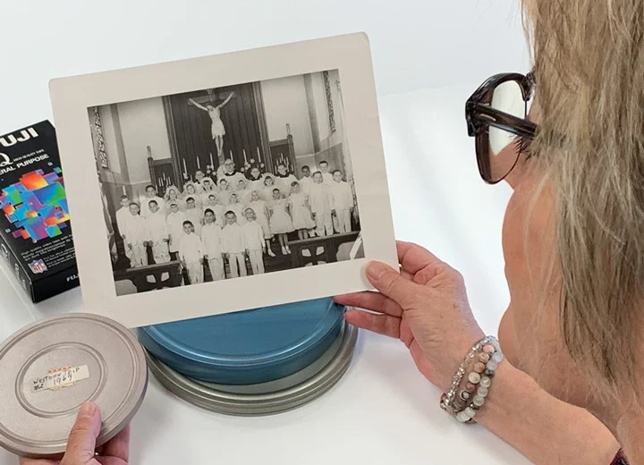 Collection of church photos and printed records ready for commercial archiving