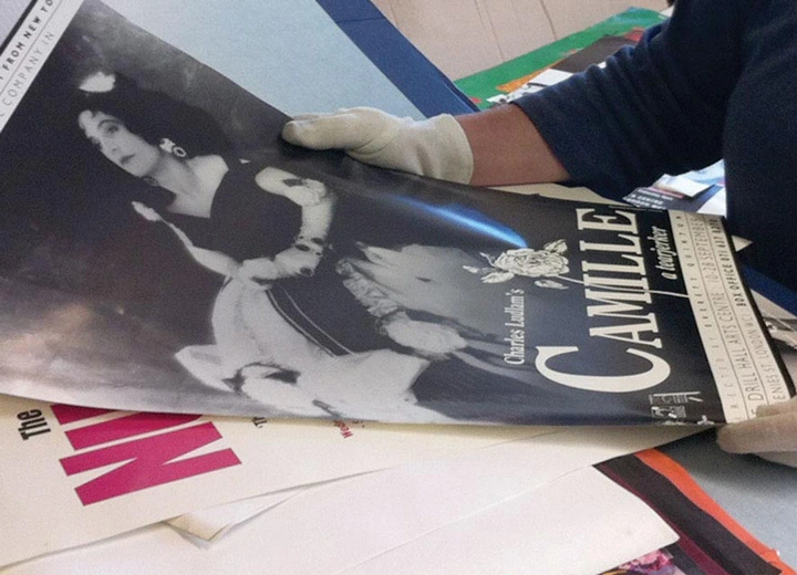 Faded historical print being prepared for professional photo scanning and digitization