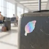 Holographic Die Cut leaf sticker on suite case.   