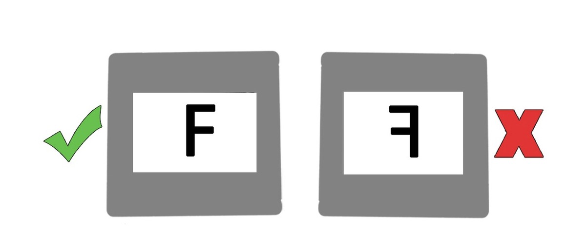 Diagram showing a slide loaded shiny side toward you, with the letter F reading correctly
