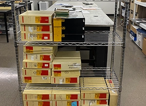 Shelf of slide collections ready for professional scanning