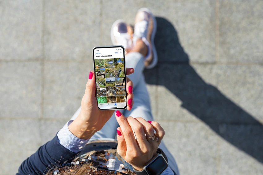 Photo album on phone being organized for data transfer