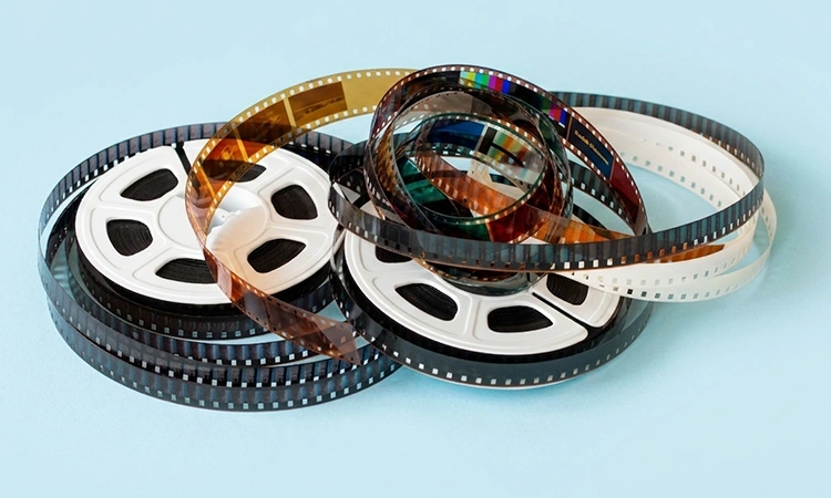 Super 8 film reel cleaned and scanned on organic LED scanner at Mark's Photo Grand Rapids MI