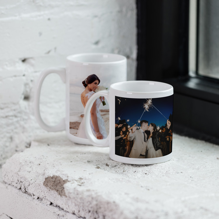 Two custom photo mugs featuring wedding images, placed on a windowsill