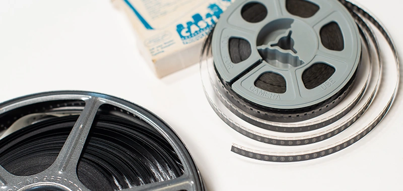 Digitized home movie footage playing on a tablet after professional film reel transfer at The Camera Shop in St. Cloud, MN