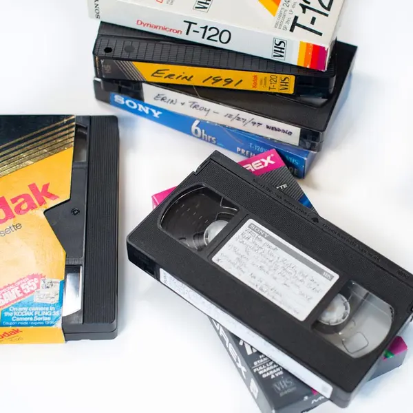 Collection of vintage VHS tapes of home recordings ready to be digitally converted