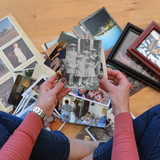Woman chooses pictures for The Gather Box for Prints from Harold's Photo