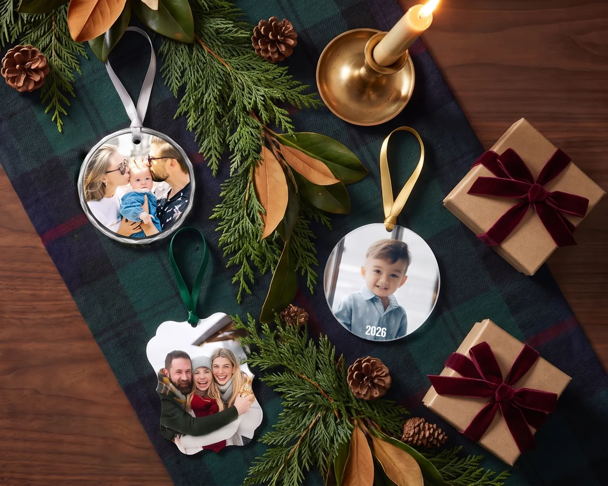 Photo ornaments on a tartan runner with greenery