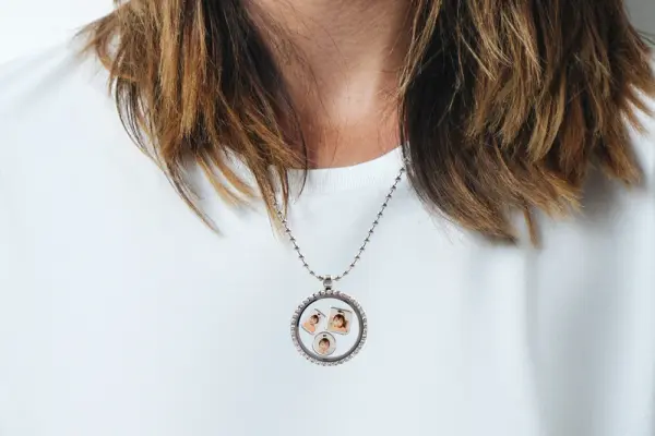 Floating locket necklace with three photo charms inside