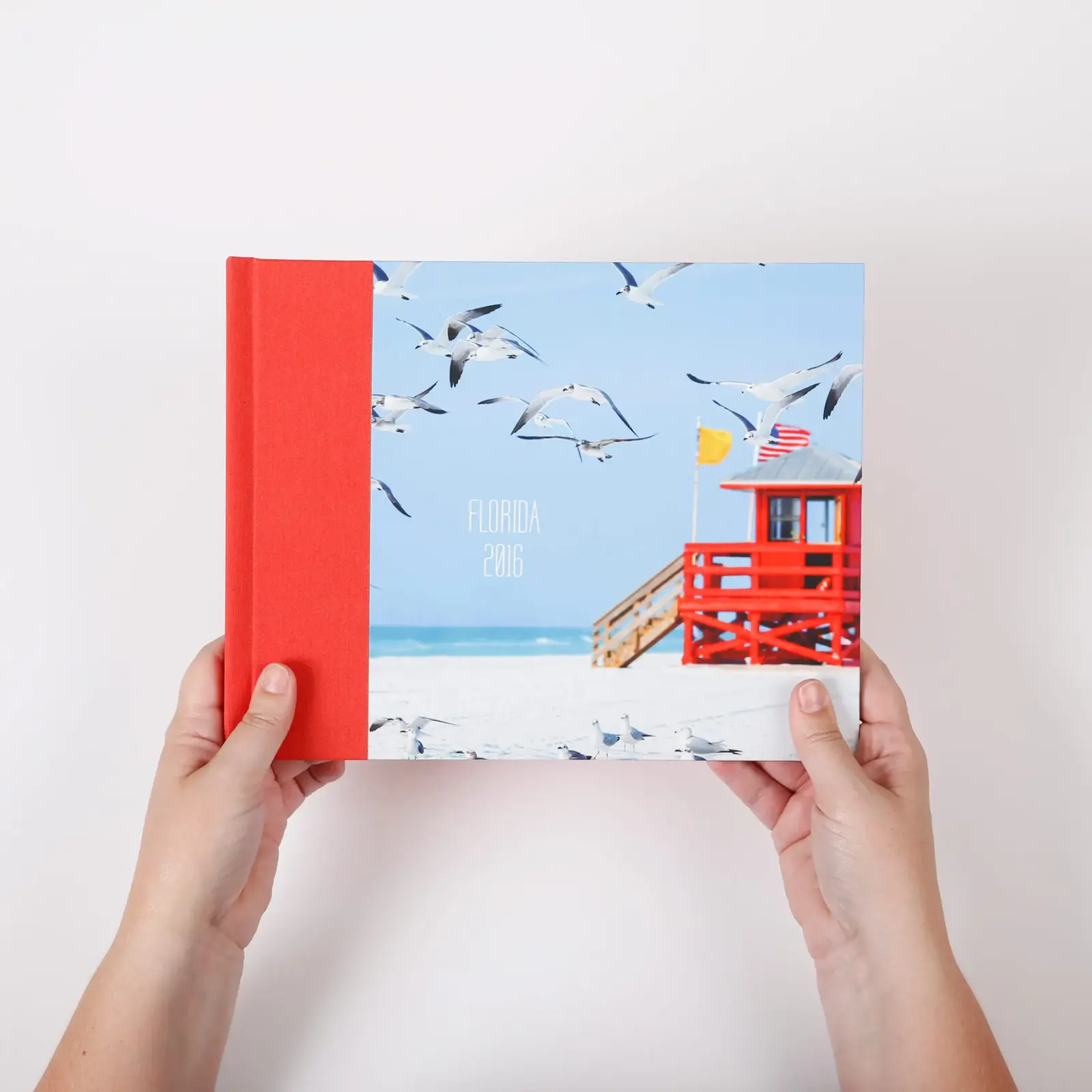 Red linen wrapped travel photo book