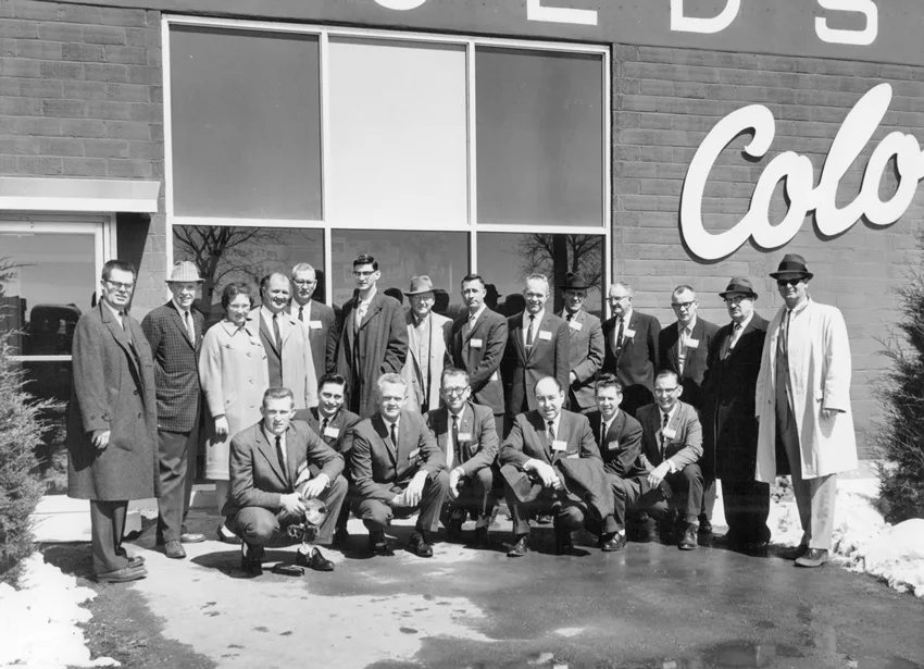 Vintage photo of past employees in front of Harold's Photo building in Sioux Falls, SD