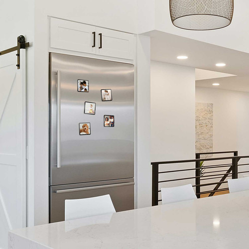 Black framed 4x4 magnet photo print on fridge in kitchen