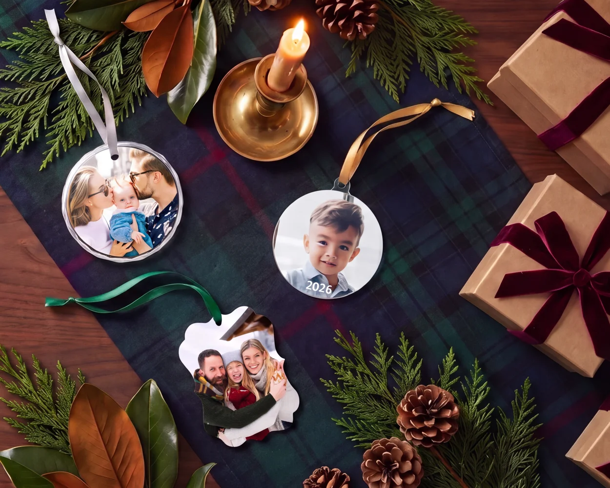 Photo ornaments on a tartan runner with greenery