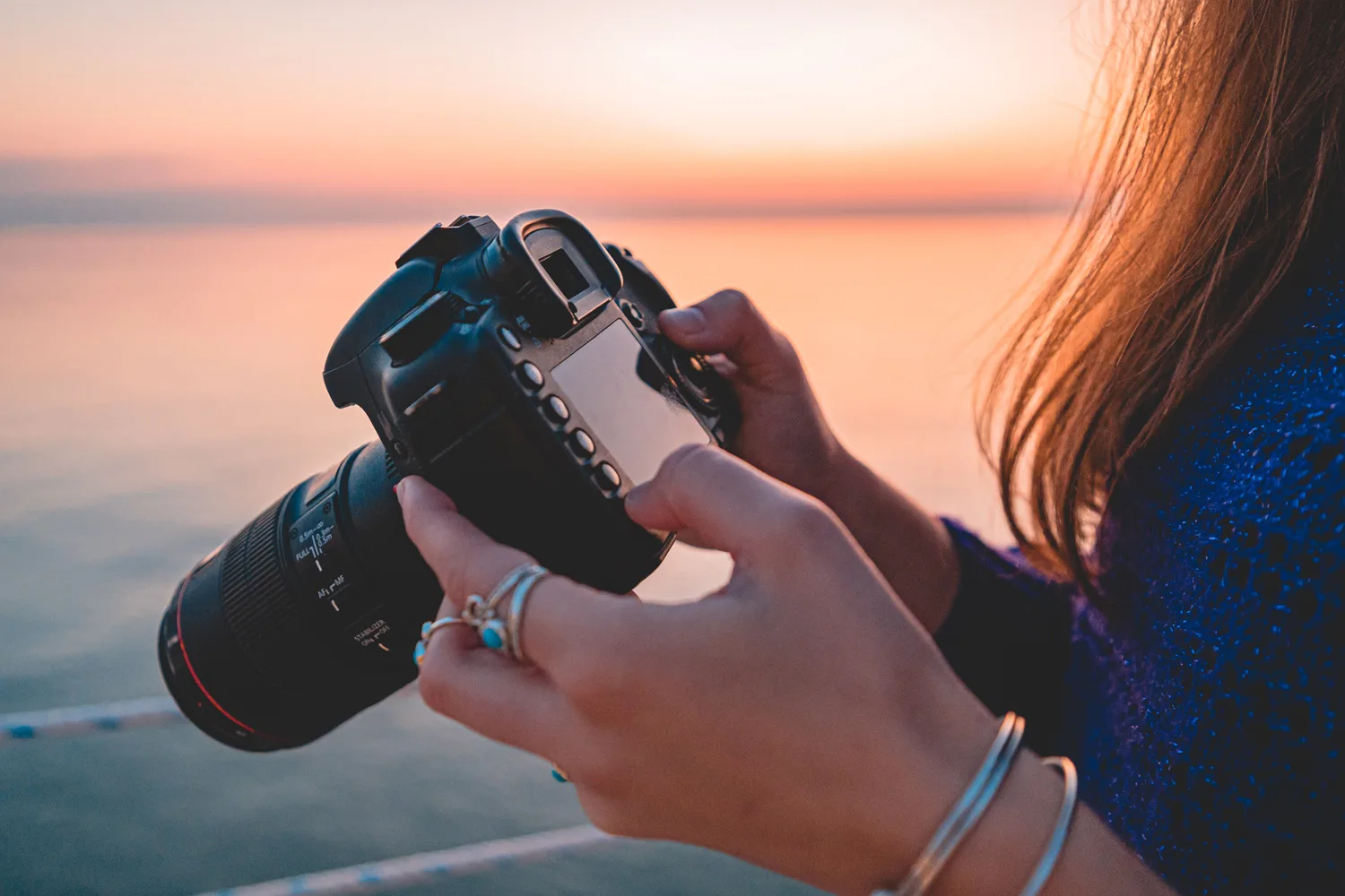 Photographer troubleshoots digital camera in need of repair