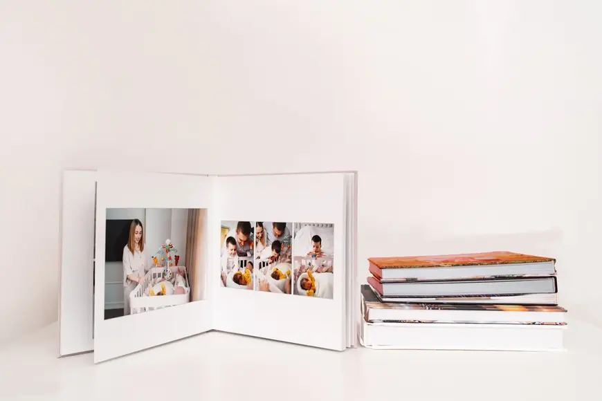 A fan-shaped stack of printed photos from various vacations.