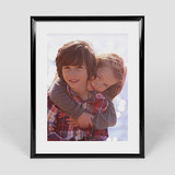 16x20 vertical poster in black frame	