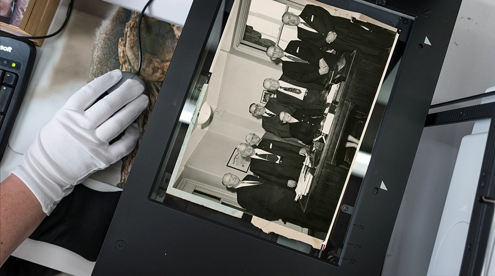 High-resolution scanning of organization photos and records on a professional monitor