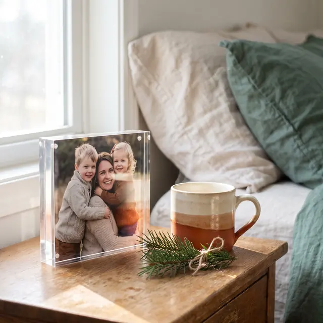 Acrylic photo block on a bedside table
