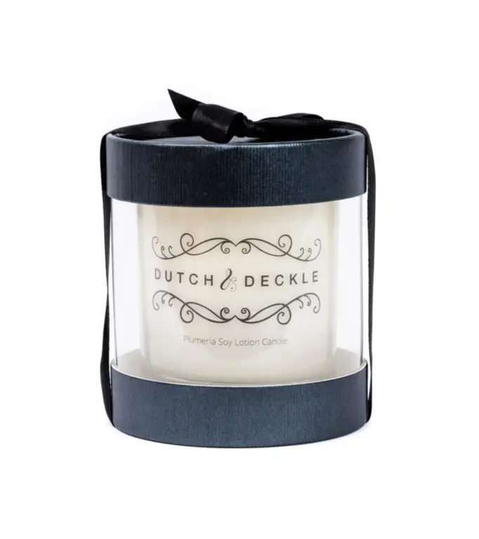 Dutch & Deckle Plumeria Scented Soy Lotion Candle inside beautiful clear box with black ribbon